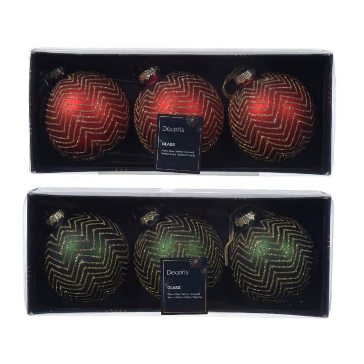 Glazen kerstballen in rood, groen en zwart met gouden zigzagpatronen, verpakt in een doos.