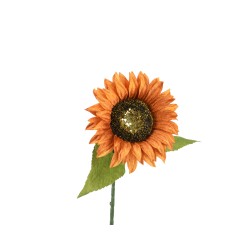 A vibrant orange sunflower with a glittery center and green leaves.