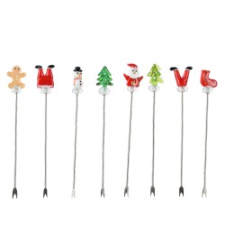 Colorful holiday-themed cocktail picks with festive toppers like Santa and a gingerbread man.