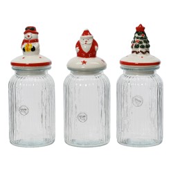 Drie glazen voorraadpotten met kleurrijke, feestelijke deksels: een sneeuwman, kerstman en kerstb...