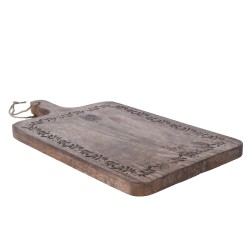 A rustic wooden cutting board with ornate floral carvings along the edges.