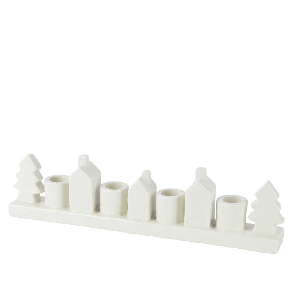A minimalist white candle holder shaped like houses and trees, perfect for festive decor.