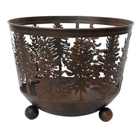 A rustic metal basket with intricate tree cutouts and rounded feet.