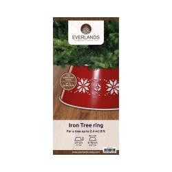 A red iron tree ring with white snowflake cutouts, displayed on a wooden surface.