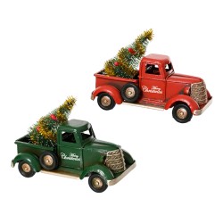 Two vintage-style trucks, one red and one green, each carrying a small Christmas tree.
