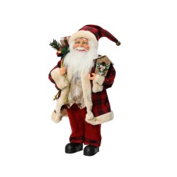 A cheerful Santa in a red tartan coat, holding gifts and a small tree.