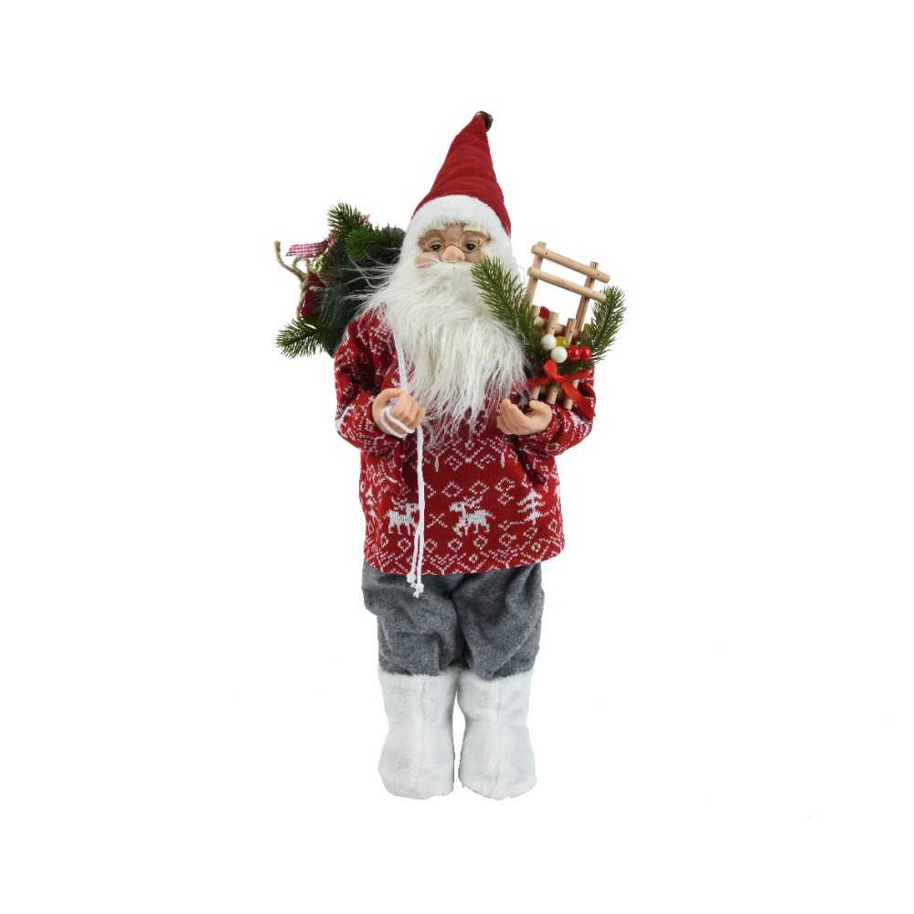A festive Santa figure in a red patterned sweater, gray pants, and white boots, holding a sled.