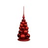 A shiny red decorative Christmas tree made of glossy spheres, topped with a pointed finial.