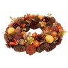 A circular wreath adorned with pinecones, autumn leaves, and orange accents.
