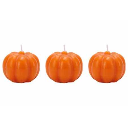 Three small, glossy orange pumpkin candles with ridged surfaces and white wicks.