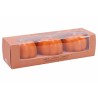 Three small, orange pumpkin-shaped candles in a clear box with a brown paper base.
