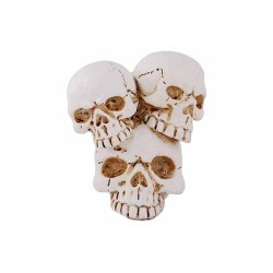 Three stacked skulls in a weathered white finish, showcasing intricate cracks and details.