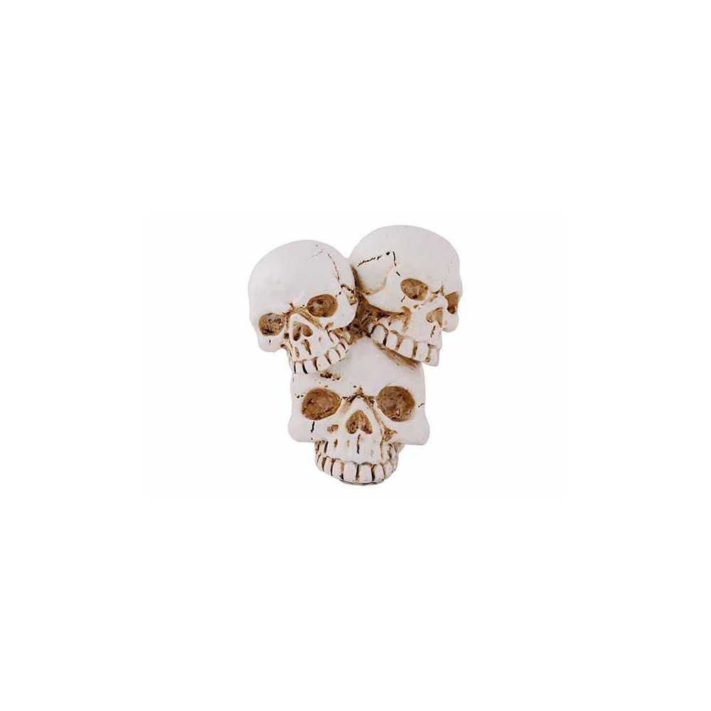 Three stacked skulls in a weathered white finish, showcasing intricate cracks and details.
