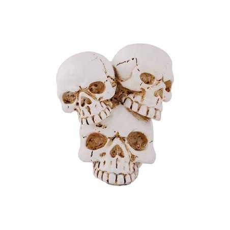 Three stacked skulls in a weathered white finish, showcasing intricate cracks and details.