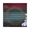 A circular metal wreath adorned with warm white lights against a dark wooden background.
