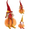 A whimsical doll in a vibrant orange pumpkin, wearing a red hat and striped stockings.