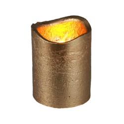 A textured gold candle holder with a warm, flickering glow at the top.
