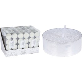 Zeshoekige witte theelichten in een glanzende doos naast een grote, transparante kaars met glitters.