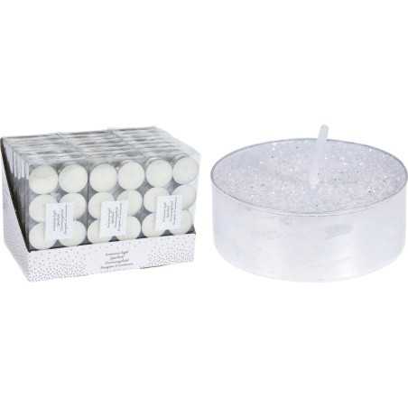 A set of white tealight candles beside a large, sparkly, clear candle holder.