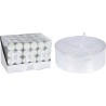 A set of white tealight candles beside a large, sparkly, clear candle holder.