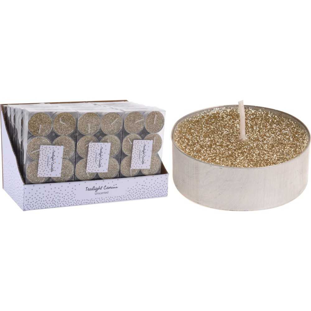 A shimmering gold candle with a sparkly top, accompanied by a box of matching tealights.