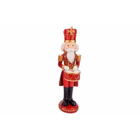 A festive nutcracker soldier in red and gold, holding a drum with a white beard and crown.