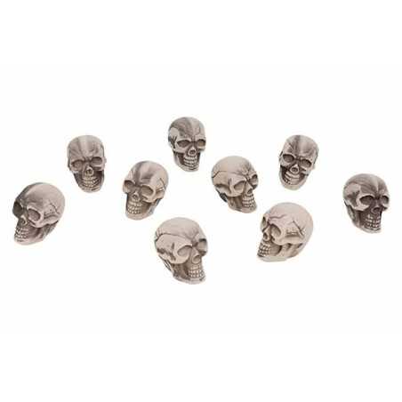 A collection of small, gray skulls with detailed features arranged in a scattered pattern.