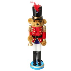 A bear soldier figurine in a red uniform, black hat, and white pants, holding a trumpet.