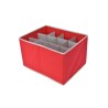 A bright red storage bin with white dividers creating multiple compartments.
