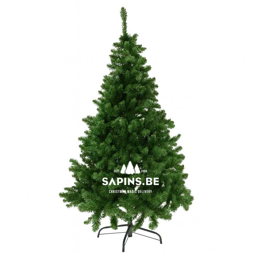 A lush, green artificial Christmas tree with a metal stand, shaped in a classic conical form.