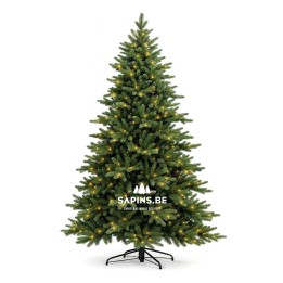 Groene kunstkerstboom met takken, verlicht met warme, gele lampjes en een metalen standaard.