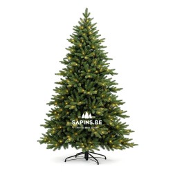 A lush green artificial Christmas tree with warm white lights and a sturdy black stand.