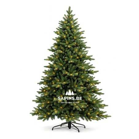 A lush green artificial Christmas tree with warm white lights and a sturdy black stand.