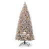 A tall, frosted Christmas tree with a snowy appearance and a sturdy black base.