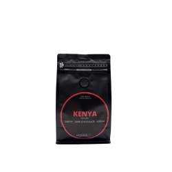 A sleek black coffee bag with bold red and white text, featuring earthy flavor notes.