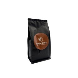 A sleek black coffee bag with a round brown label featuring the text "HIGH FIVE."