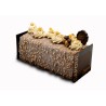 A rectangular cake topped with creamy swirls, nuts, and decorative chocolates.