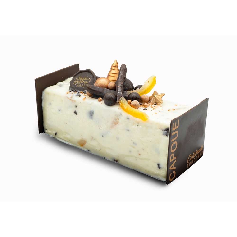 A rectangular cake topped with dark chocolate elements and orange accents on a white base.