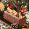 A festive chocolate yule log adorned with cream swirls, nuts, and holiday decorations.