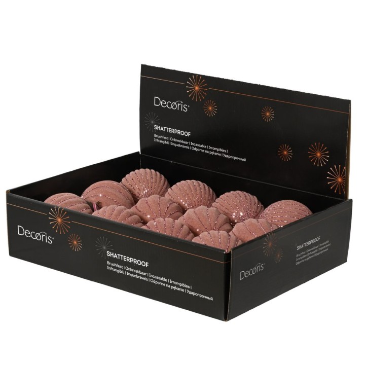 A box filled with shimmering, pink, shell-shaped ornaments.