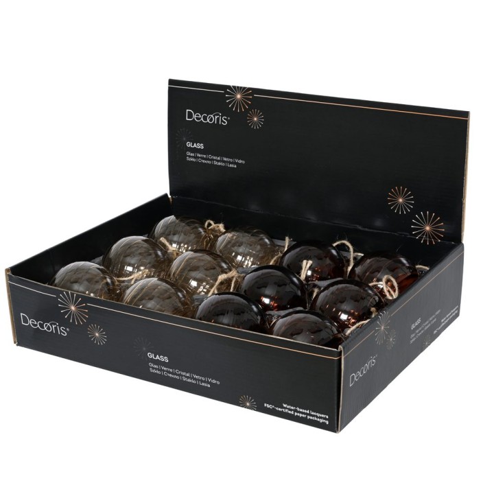 A box of glass ornaments in dark, earthy tones, featuring a mix of matte and shiny finishes.