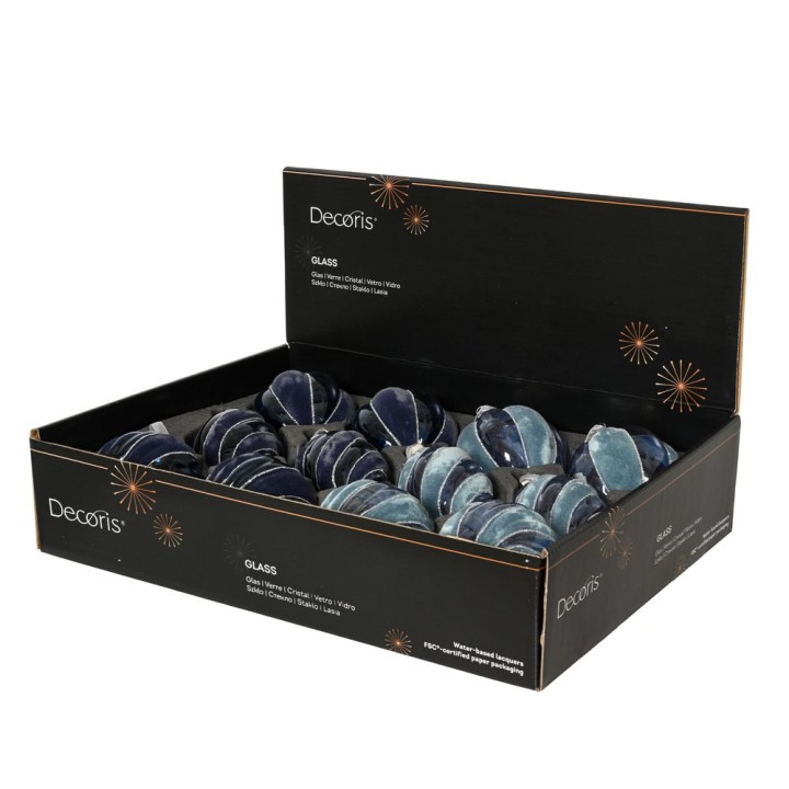 A black box filled with colorful, smooth glass ornaments in varying shades of blue and green.