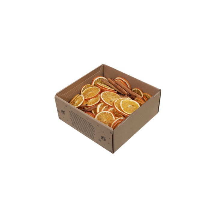 A cardboard box filled with dried orange slices and cinnamon sticks.
