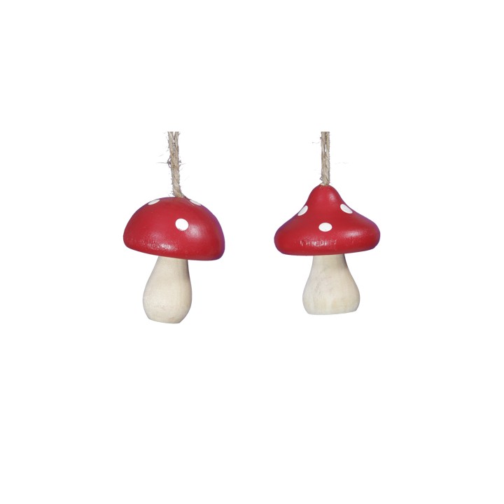 Two red mushroom ornaments with white spots, hanging by natural twine.
