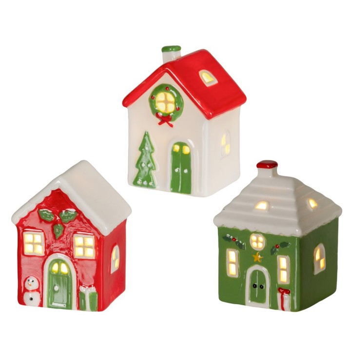 Kleine keramische huisjes in vrolijke kerstkleuren, met details als sneeuwpop en kerstboom.