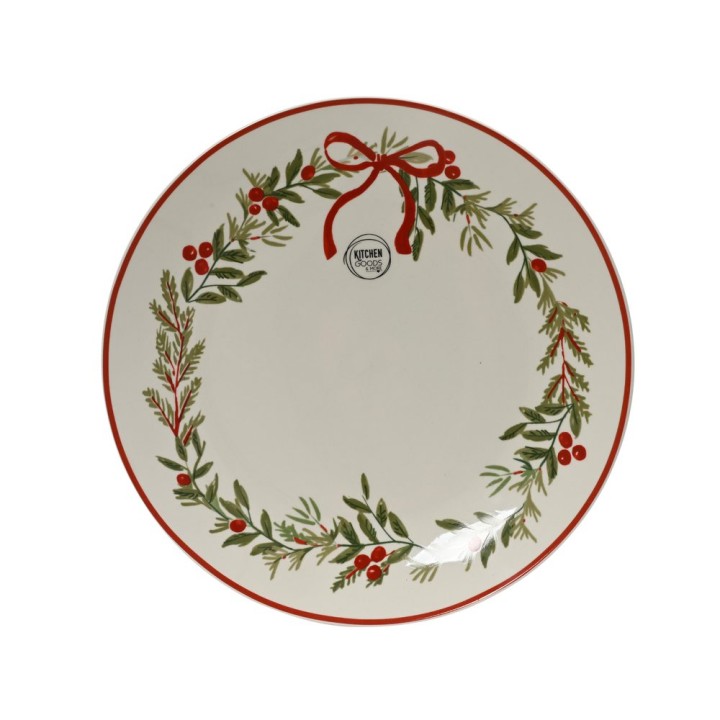 A circular white plate adorned with a green wreath and red berries, framed by a red rim.