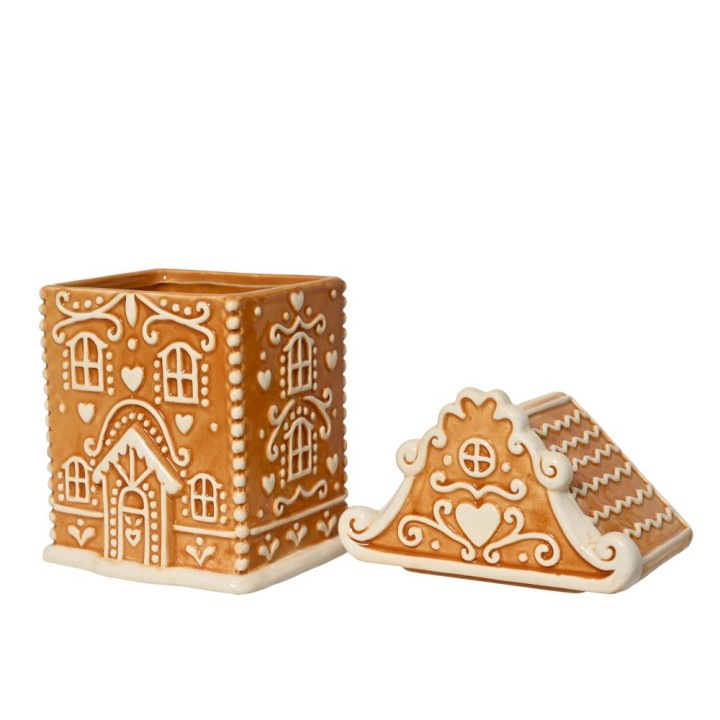 A brown, gingerbread-style container with white icing details and heart motifs.