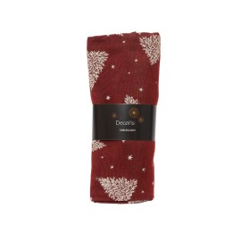 A folded red tablecloth adorned with white tree and star patterns, tied with a black band.