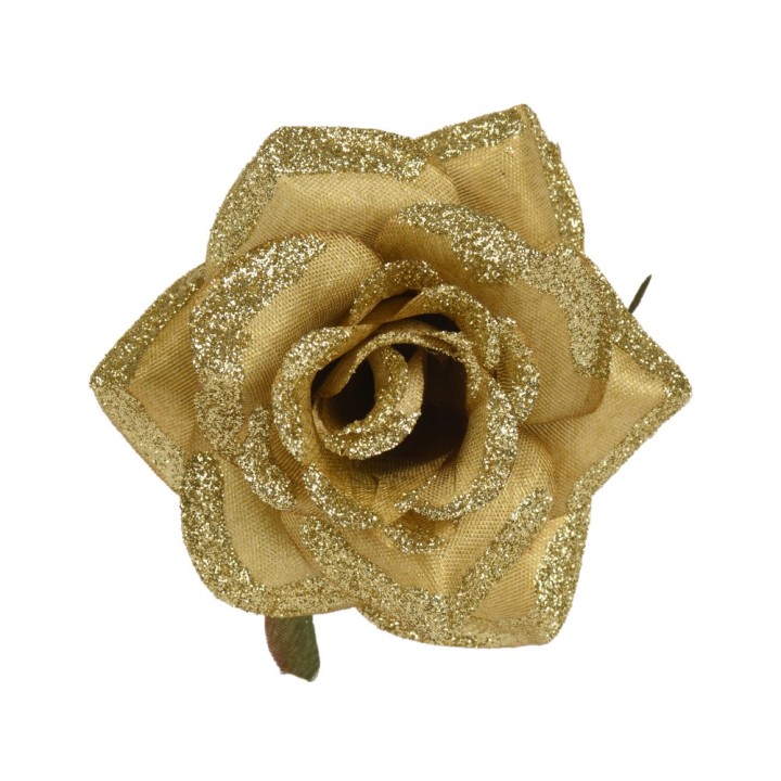 Gouden rozenknop van stof met glitter, elegant en glanzend, met groene bladeren.