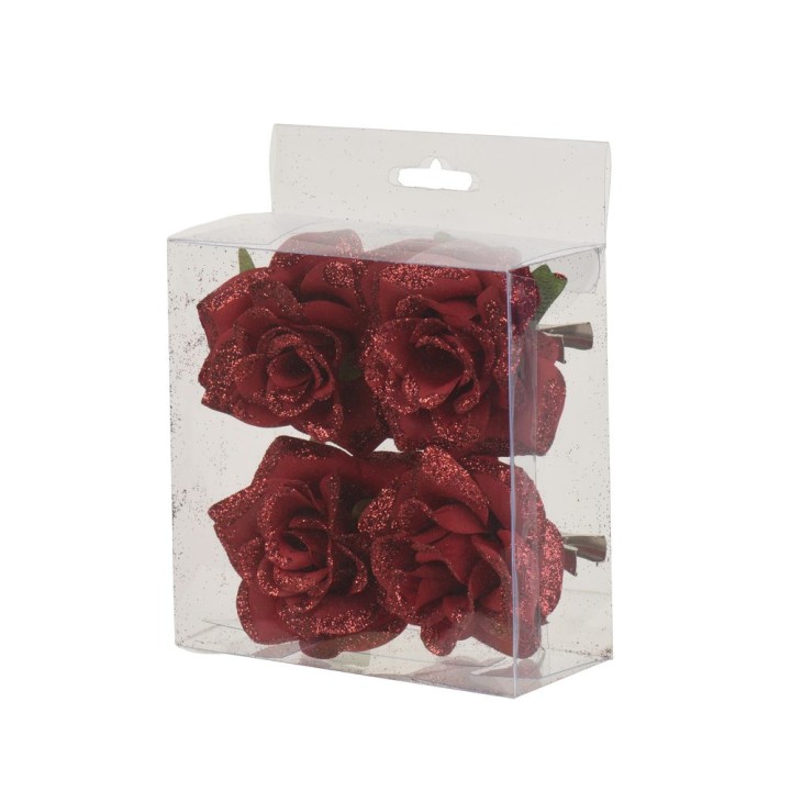 A clear box containing four glittery red roses with green leaves.